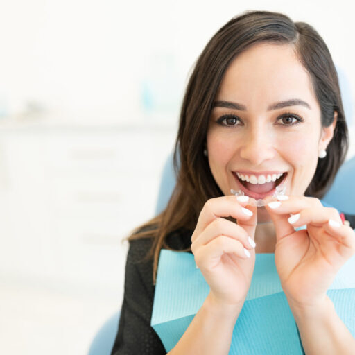 Woman fitting Angel Aligner clear aligners at Cannon Hill Smiles, a discreet Invisalign alternative in Brisbane